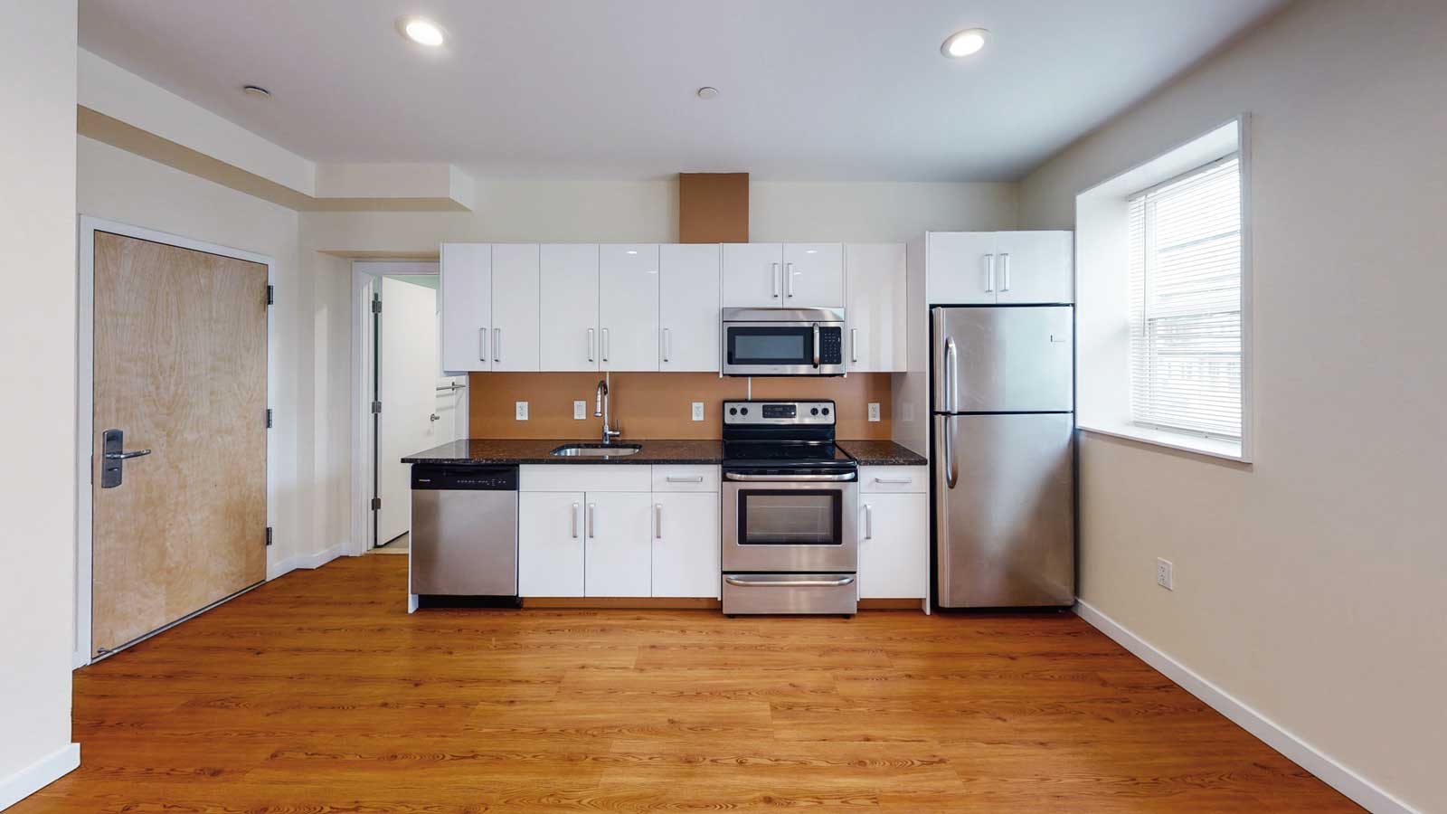 Renovated apartment kitchen and living area
